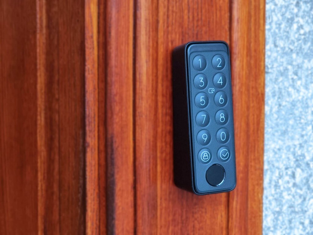 SwitchBot Lock Pro Keypad installed on wooden door