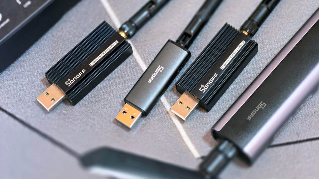Sonoff Dongles On Table: Comparison by SmartHomeScene